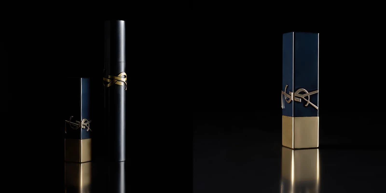 Deux rouges à lèvres Yves Saint Laurent et un mascara sur fond noir